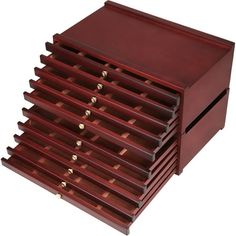 a wooden jewelry box with six drawers