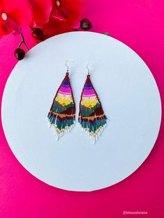 These beautiful beaded earrings are so colorful and perfect for all-day wear. They are definitely the perfect accessory to style up your look and add personality to your outfit. These lovely handmade earrings are made with sterling silver hooks and colorful beads. Each pair of earrings that we sell is authentic and one-of-a-kind! Finds more styles at https://www.etsy.com/shop/LatinxsCulturaViva?ref=simple-shop-header-name&listing_id=990207426&section_id=26730499 Thank you so much for vis Colorful Tiny Beads Dangle Earrings, Colorful Dangle Earrings With Tiny Beads, Handmade Colorful Beaded Drop Earrings, Bohemian Rainbow Earrings With Tiny Beads, Multicolor Beaded Drop Earrings For Pierced Ears, Multicolor Beaded Festival Earrings, Multicolor Dangling Beads Earrings For Gift, Multicolor Drop Beaded Earrings For Pierced Ears, Festival Tiny Beads Drop Earrings