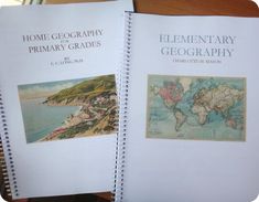 two books with maps on them sitting next to each other