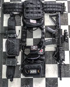 several different types of equipment laid out on a checkered floor