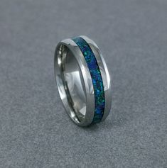 DISCLAMER THIS ring is made for this Photo. I have a decision to close my shop and sell all of my rings with a BIG discount in a specified ring SIZE. US7 -Mineral(s): Lapis Lazuli, Malachite, Chrysocolla -Opal(s): Blue Opal -Color: Blue and Green -Ring Material: Stainless Steel (316L) -Band Width: 6mm -Shipping: EU:6-10 Workdays, Outside The EU: 7- 14 Workdays -Ring Inside: Comfort Fit -Antiallergenic 💍Stainless steel rings offer numerous benefits, combining durability, affordability, and style Affordable Blue Hypoallergenic Rings, Opal Band, Green Rings, Blue Ring, Opal Color, Protection Stones, Stainless Steel Ring, Ring Blue, Ring Promise