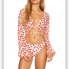 The Dover Top Is A Long Sleeve Crop Top Featured In A Retro Red And White Cherry Print. This Versatile Top Features A Wrap Around Tie Closure And Can Be Tied In The Front Or Back. Wear This Top With A Pair Of Denim Shorts Or With Our Cherry Print Chelsea Bottom For A Fun Beach Look. 100% Rayon Spring V-neck Top For Poolside, Spring Poolside V-neck Top, Long Sleeve Tops For Poolside Vacation, Chic White Long Sleeve Swimwear, Chic Long Sleeve Swimwear For Beach Party, White V-neck Tops For Poolside, Spring Long Sleeve Tops For Poolside, Spring Long Sleeve Poolside Tops, Chic Long Sleeve Tops For Vacation