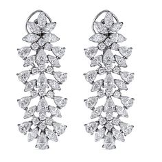 These impressive 18kt white gold drop earrings showcase 15.32cts of dazzling marquise, pear, and round diamonds in an elegant multilevel design. Handcrafted in Italy by ZYDO Italian Jewelry.Diamond Quality: Color F, Clarity VSDiamond Carat Weight: 15.32Dimension: 2 1/8 in. x 3/4 in. White Gold Drop Earrings, Italian Jewelry, Jewelry Diamond, Classic Chic, Pendant Rings, Gold Drop Earrings, Ring Collections, Boutique Jewelry, High Quality Jewelry