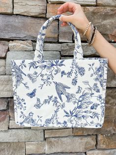 Elevate your summer fashion game with Shiraleah's Amanda Tote! This chic and sturdy canvas bag boasts a stunning, feminine floral print that adds a touch of elegance to any outfit. Its bold colors and strong construction make it the perfect accessory for seasons to come. Complement your style with other Shiraleah pieces! Features include cotton fabric, double handles, a magnetic snap closure, and inner zip and slip pockets. Sweet Grace Candle, Teacher Gift Card, Casual Work Wear, Pink Pineapple, Pastel Dress, Blue Tote, Star Spangled, Next Clothes, Capri Blue