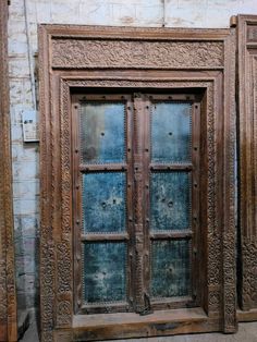 an old wooden door with intricate carvings on it