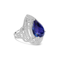 Make a statement with our breathtaking Tanzanite and White Diamond Ring. Crafted in 18K White Gold, this exquisite ring features a stunning 15.00 carat Tanzanite center stone, beautifully accented by 2 carats of sparkling White Diamonds. With a metal weight of 5.25 grams, this ring is a true symbol of luxury and elegance. Fine Jewelry Tanzanite In White Gold, Diamond White Tanzanite Round Jewelry, Brilliant Cut Tanzanite Diamond Ring In White Gold, Luxury White Gold Tanzanite Diamond Ring, Luxury Tanzanite Gemstones In White Gold, January Birthstone Jewelry, Yellow Jewelry, April Birthstone Jewelry, Brown Jewelry