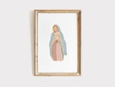 a framed painting of the virgin mary in pastel blue, pink and gold colors