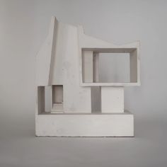 a white sculpture sitting on top of a table