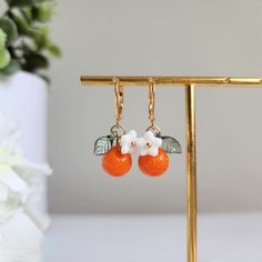 Orange earrings Cute Nickel-free Orange Jewelry, Orange Earring Jewelry Gift, Orange Adjustable Dangle Flower Earrings, Handmade Orange Dangle Flower Earrings, Nickel Free Orange Drop Earrings, Orange Drop Earrings For Gift, Orange Dangle Flower Earrings With Ear Wire, Nickel-free Orange Drop Earrings, Cute Nickel-free Orange Earrings