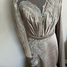 This Is A Custom Couture Gown. One Of A Kind Beautiful Satin Quality. The Right Arm Is Full Sleeved With Beading And The Left Arm Is A Cape. The Dress Is Fully Lined. It Fits A Like A Size 8/10. More Of A 10 Around The Hips. The Bottom Fits Like A Trumpet Gown. Definitely A Show Stopper! Only Worn Once For A Few Hours! Dry Cleaned! Luxury Embellished Gray Evening Dress, Fitted Silver Gown With Intricate Embroidery, Art Nouveau Evening Gowns, Dresses Couture, Couture Gown, Trumpet Gown, Gown Dress, Couture Gowns, Custom Dresses