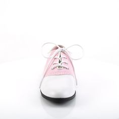 Front lace up saddle shoes in pink- our favorite color! Man made materials. Spring Low-top Oxford Shoes, Spring Cap Toe Oxfords, Spring Cap Toe Oxfords With Rubber Sole, Retro Brogue Lace-up Shoes For Spring, Pink Round Toe Oxfords For Formal Occasions, Pink Brogue Oxfords With Round Toe, Pink Wingtip Oxfords For Formal Occasions, White Cap Toe Oxfords For Spring, Pink Oxfords With Leather Sole And Round Toe