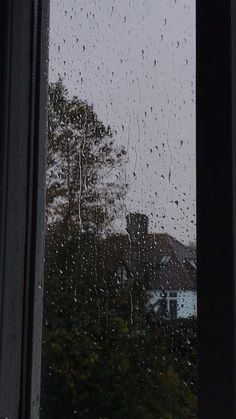 rain is falling down on the window pane