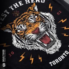 a black shirt with an image of a tiger's head and lightning bolts on it