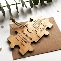 two pieces of wooden puzzle on top of an envelope with the words, some like love