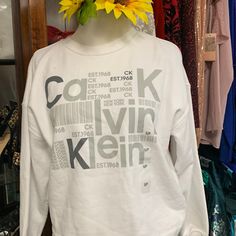 Calvin Klein White Sweatshirt Size S/P Calvin Klein White Relaxed Fit T-shirt, Calvin Klein Relaxed Fit Sweatshirt For Fall, Spring Calvin Klein Crew Neck Top, Calvin Klein Spring Crew Neck Top, Calvin Klein Cotton Tops For Fall, Calvin Klein Logo Print Sweatshirt For Fall, Calvin Klein Relaxed Fit Letter Print Top, Trendy Calvin Klein Crew Neck Tops, White Calvin Klein T-shirt For Spring