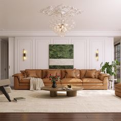 a living room filled with furniture and a chandelier