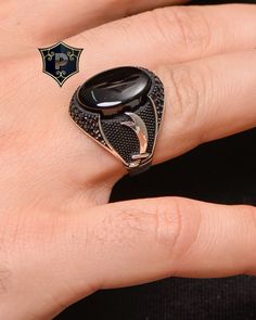 "Zulfiqar Silver Ring, Men's Black Onyx Silver Ring, Handmade Ring, 925 Sterling Silver Ring, Sword Ring, Gift for Men, Turkish Ring ✦ Details ✦ * Material: 925 Sterling Silver * Gemstone: Onyx * Weight: 14.00 grams * The size of the stone: 15x20 mm. * Sides oxidized, decorated with Garnet stones and Micro Zircon stones. * Stamp: 925 * Available sizes; 5 US to 16 US. Contact me if you need any other size! ✦ Shipping ✦ * Processing time: 1-3 business days. * This item ships from my Turkish workshop in Istanbul. * Add your phone number in address box for a smoother delivery. That makes courier personnel's job easier.  ✦ Packaging ✦ * Comes with a luxury gift box and a jewellery cleaning cloth and courtesy gift. ✦ Returns, Exchanges ✦ * Return option available for 30 days after the delivery. Turkish Rings For Men, Onyx Silver Ring, Turkish Ring, Mens Ring Designs, Unique Ring Designs, Turkish Rings, Mens Rings Fashion, Silver Gold Jewelry, Magical Jewelry