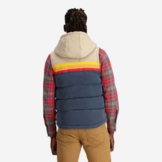 The Epic Fader Puffer Vest is the ultimate fusion of function and fashion. With its vibrant, vintage-inspired exterior and cozy layer of soft micro-flannel on the inside, this retro puffer vest looks as good as it feels. The fill is 100% polyester and the outside fabric is a plush, water-resistant cotton. Additional features are 2 inside pockets and high-quality YKK® Zippers. Get one now and let your retro style shine! Female Model is 5'10" / 130 lbs and is wearing a size XS Male Model is 5'11" Cozy Vest, 130 Lbs, Broad Shoulders, Hooded Vest, Kim K, Tall Girl, Female Model, Mens Vest, Puffer Vest