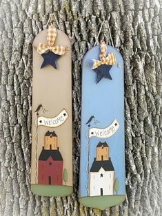 two bookmarks are hanging on a tree with the words welcome to us and an image of a house