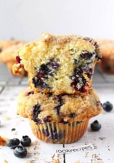 two blueberry muffins stacked on top of each other