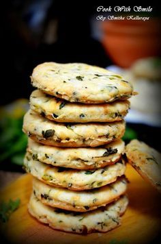 a stack of cookies sitting on top of a wooden cutting board