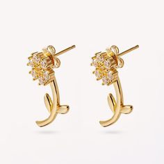 Introducing our stunning "Every Daisy Is Better With You Earrings" - a dazzling and delicate pair of daisy stud earrings crafted from 925 sterling silver and finished with a luxurious 18k gold plating. The interchangeable stem back allows you to switch up the look, making these earrings a great versatile addition. Maintain your jewellery’s high shine by avoiding contact with any chemicals such as soap, perfume, lotion, makeup, hair & cleaning products. Gift Earrings With Flower Shape And Prong Setting, Flower-shaped Earrings With Prong Setting For Gift, Flower Shaped Earrings With Prong Setting, Flower Shaped Diamond Earrings For Gift, Diamond Flower Drop Earrings For Gift, Diamond Drop Earrings Flower Shaped For Gift, Diamond Flower Drop Earrings As Gift, Sterling Silver Diamond Earrings With Flower Shape For Gift, Sterling Silver Flower-shaped Diamond Earrings As Gift