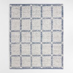 a blue and white rug with squares on it