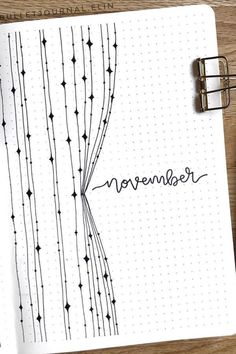 an open notebook with the word november written on it