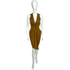 Introducing the exquisite Thierry Mugler Brown Fitted Dress, a timeless piece that embodies sophistication, elegance, and the renowned craftsmanship of the iconic fashion house. This dress is a true testament to Mugler's ability to create garments that accentuate the female form with precision and grace. Crafted with meticulous attention to detail, this fitted dress is designed to enhance your natural curves and create a flattering silhouette. The rich brown hue adds a touch of warmth and versat Elegant Brown Fitted Midi Dress, Classic Fitted Brown Midi Dress, Elegant Brown Sheath Midi Dress, Classic Brown Formal Dress, Elegant Semi-formal Brown Dresses, Formal Brown Sheath Midi Dress, Brown Sheath Midi Dress For Formal Occasions, Chic Fitted Brown Midi Dress, Chic Brown Fitted Midi Dress