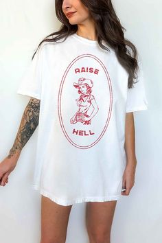 RAISE HELL COUNTRY COWGIRL WESTERN OVERSIZED GRAPHIC TEEPREMIUM COTTONOVERSIZED FIT Summer Cotton Tops With Back Print, Cotton Tops With Back Print For Summer, Spring Tops With Back Print And Short Sleeves, Retro Summer Tops With Back Print, Cotton T-shirt With Back Print For Spring, Spring Cotton T-shirt With Back Print, Retro White Tops With Back Print, Cotton Spring T-shirt With Back Print, Spring Band Merch Cotton Top