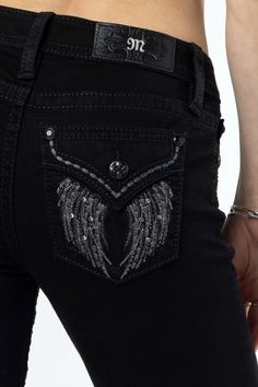 - Mid-rise, black bootcut jeans- Dark grey embroidery with hints of metallic silver and black stitching throughout downturn wing design- Mini grey rhinestone rivets throughout design with a faux flap pocket- Black rhinestone rivets- Black leather M logo brand patch- 5-pocket design- 70% Cotton 20% Polyester 8% Viscose 2% Elastane- Gentle machine wash inside-out with like colors in cold water, Tumble dry low Model is wearing size: 25 Model Measurements: Height: 5'10" Bust: 32" Waist: 25.5" Hips: 36" Style No. M5082B162-B01, M5082B162S-B01, & M5082B162V-B01 Black Low Rise Jeans, Grey Embroidery, Black Bootcut Jeans, Bling Jeans, Wing Design, Chic Jeans, M Logo, Straight Clothes, Pretty Prom Dresses