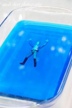 a person floating in the water with their arms out and feet apart from each other