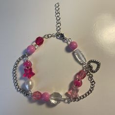 A handmade bracelet inspired by Barbie. Made with glass beads and wire, has a cute heart charm and is adjustable! Barbie Bracelet, Bracelet Inspired, Valentine Ideas, Cute Heart, Wire Bracelet, Pink Bracelet, Beads And Wire, Handmade Bracelet, Charm Bracelets