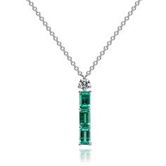 Elevate your style with our Three Emerald Line Pendant. The centerpiece is a substantial 1.00ct gem, complemented by a 0.13ct Round-cut Diamond, adding sparkle and charm. Crafted meticulously in 18K White Gold, this pendant (2.92g) boasts a total weight of 1.13ct across four gemstones. The 40cm chain offers versatility for various occasions, making it a testament to your refined taste and timeless elegance. Eshed is a worldwide diamond and emerald supplier.  From Fifth Avenue in New York to La Place Vendome in Paris, and from London's Bond Street to Asia's finest shopping centers, Eshed is a trusted source for precious stones. Free shipping + 100% money-back guarantee   Necklaces Specifications: ✦ White Gold ✦ Stone Type: Natural Emeralds  ✦ Shape:  ✦ Carat: 1 ✦ Clarity:  ✦ Color: Green Fe Luxury Emerald Cut Diamond Necklace In Sterling Silver, Luxury Sterling Silver Emerald-cut Diamond Necklace, Luxury White Gold Emerald Necklace With Prong Setting, Luxury Emerald-cut Diamond Necklace In Sterling Silver, Platinum Gemstone Necklace In Fine Jewelry Style, Baguette Cut Diamond Emerald Necklace For Anniversary, Emerald Necklace With Diamond Accents In Diamond White, Emerald Necklace With Single Cut Diamonds For Anniversary, Emerald Necklaces With Diamond Accents In Diamond White