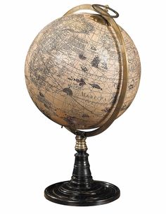 an old fashioned globe on a stand against a white background