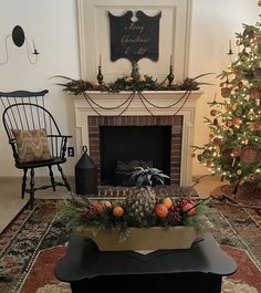 a living room filled with furniture and a fire place next to a christmas tree in front of a fireplace