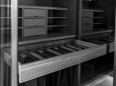 a black and white photo of an empty shelf