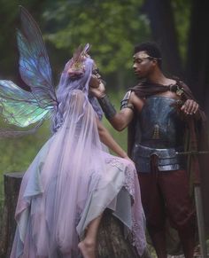 a man and woman dressed up as fairy characters