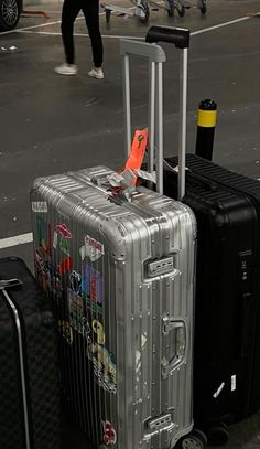 two pieces of luggage sitting on the ground