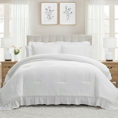 a white comforter with ruffled edges in a bedroom