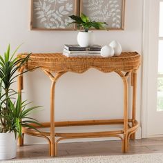 Bring the charm of exotic artistry to your space with the lovely Wakana console table. Made in Indonesia, this bohemian piece consists of natural rattan with handwoven embellishments. Its broad, rounded tabletop beautifully blends with the layout of an entryway, living room, or hallway while scalloped detailing creates an eye-catching display. The Wakana will arrive fully assembled and features an openwork base that lends a light, airy feel. Blending modern convenience with rustic grace, the Wakana console table is a fantastic adornment to any setting. Disclaimer: Rattan is a product of nature and may have variations in areas such as, but not limited to, color, pattern, grain and texture. The hair-like strands of rattan/rattan-fiber are common due to the nature of the material. Overall: 42 Rattan Console Table, Rattan Console, Farmhouse Entryway Table, Narrow Entryway Table, Console Table Entryway, Console Table With Drawers, July Ideas, Entryway Console Table, Entryway Living Room