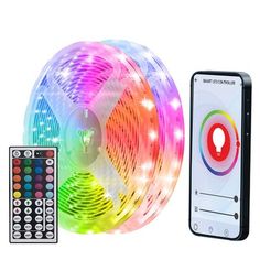 the remote control is next to a colorful light strip with controller and phone on it