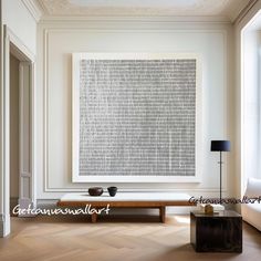 a living room filled with furniture and a large art piece on the wall above a coffee table