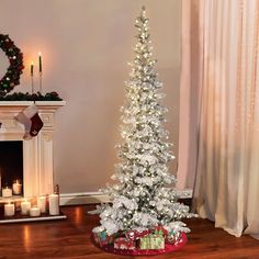 a white christmas tree in a living room