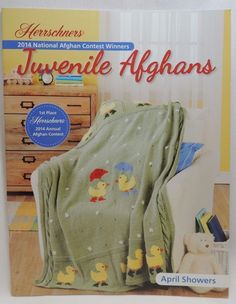 the front cover of a book with an image of a baby blanket and ducklings on it