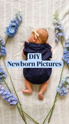 a baby laying on top of a bed next to blue flowers and a sign that says diy newborn pictures