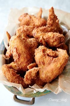 some fried food is in a bowl on a table