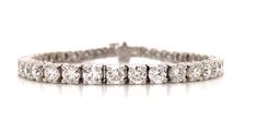 Absolutely gorgeous setting and with round diamonds will sit comfortably on her wrist without ever breaking. Metal: 14K White GoldDiamond Weight (44): Rounds 6.16ctw Bracelet Length: 18.3cmSetting: ProngLock: Box Catch With Hidden Safety Estimated production time is 4 - 5 weeks Dazzling Round Diamond Bracelet With 17 Jewels, Classic Cubic Zirconia Diamond Watch, Brilliant Cut Diamond Watch, Brilliant Cut Diamond White Diamond Watch, Vvs Clarity Diamond Bracelet For Wedding, Platinum Round Diamond Bracelet With Prong Setting, White Round Diamond Bracelet, Platinum Round Tennis Bracelet With Prong Setting, Diamond Tennis Bracelet