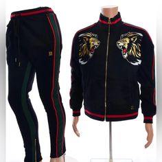 Men’s Makobi Decorative Lion Patch Fleece Track Suit-Black/Green/Red Fleece Track Jacket Has Decorative Embroidered Lion Patch Has Silver, Beige, And Red Threading Lion Patch Has Rhinestones Embedded In Its Intricate Design Heavy Duty Soft Thick Fleece Material Not Only Looks Good But Feels Good Too Track Suit Has Green And Red Striping On The Sleeves Ribbing At Cuffs, Collar, And Waistband 2 Pocket Design Has Gold Zippers And Velvety Smooth Feel Fitted Black Tracksuit For Winter, Gucci T Shirt, Suit Black, Fashion Suits For Men, Red Fleece, Track Suit, Pullover Designs, Green And Red, Gold Zipper