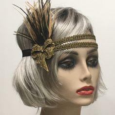 This stunning 1920's Downton Abbey vintage inspired Art Deco flapper headband is the perfect accompaniment for any styled event. I've designed and created this of a kind headband so feminine and romantic. Made with two rows of a black and gold woven trim backed with satin elastic. This headpiece features black and antique gold Ostrich feathers embellished with a Vintage Inspired Antique Brass Bow brooch with Gold Rhinestones.  I have designed and created each piece from my smoke-free studio. All pieces are securely wrapped and boxed to prevent damage/breakage. Ready to ship.  Feel free to convo me if you have any questions. Thank you very much for visiting my shop. Have a blooming day! Flapper Style Fascinator Headband For Party, Adjustable Gatsby Style Costume Hats For Evening, Adjustable Gatsby Evening Headpiece, Adjustable Gatsby Style Evening Costume Hat, Vintage Adjustable Costume Accessories For Wedding, Vintage Adjustable Costume Accessories For Costume Party, Adjustable Vintage Costume Accessories For Wedding, Vintage Gold Headpiece For Evening, Vintage Adjustable Costume Hats And Headpieces For Party